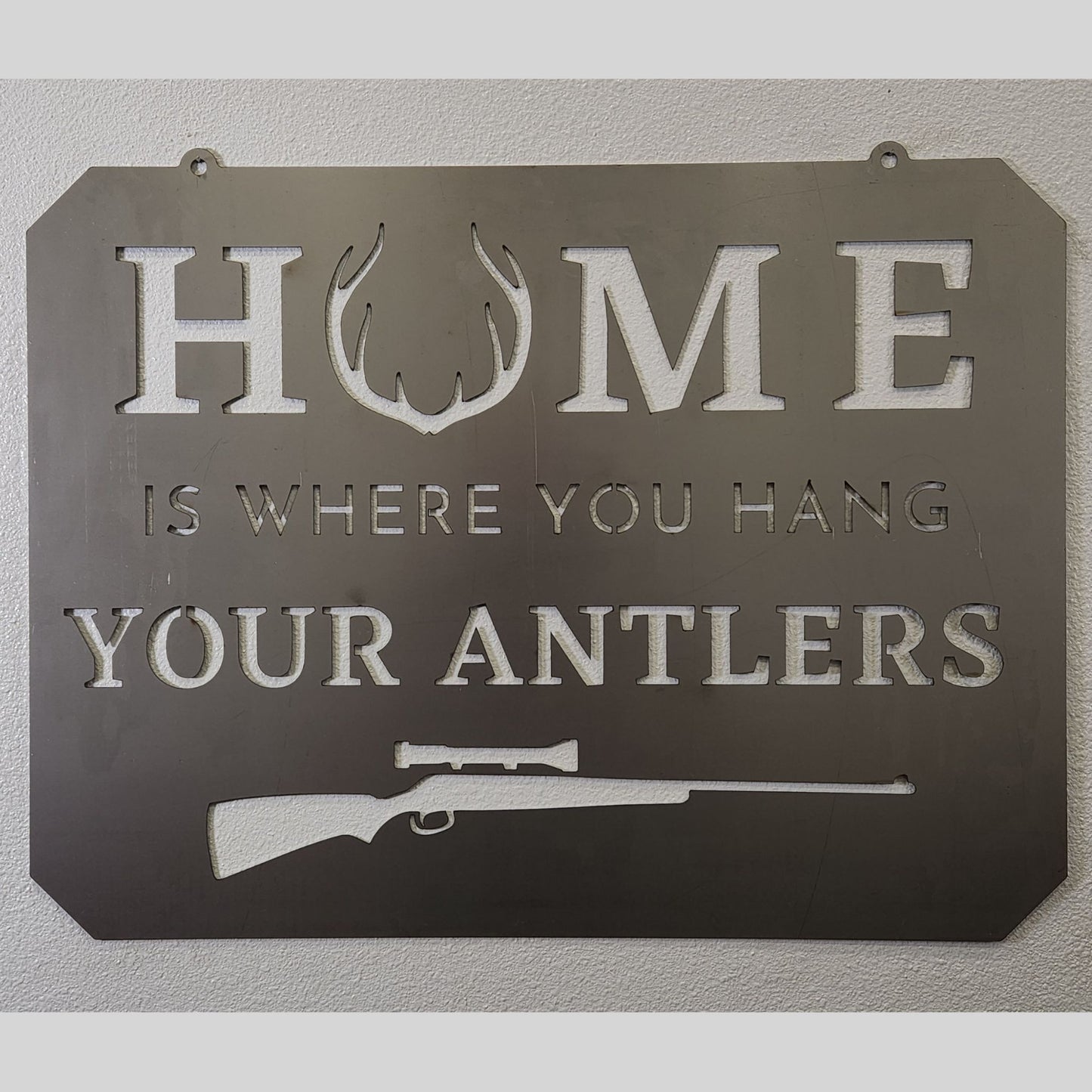 "Home Is Where You Hang Your Rifle" Metal Hunting Wall Decor